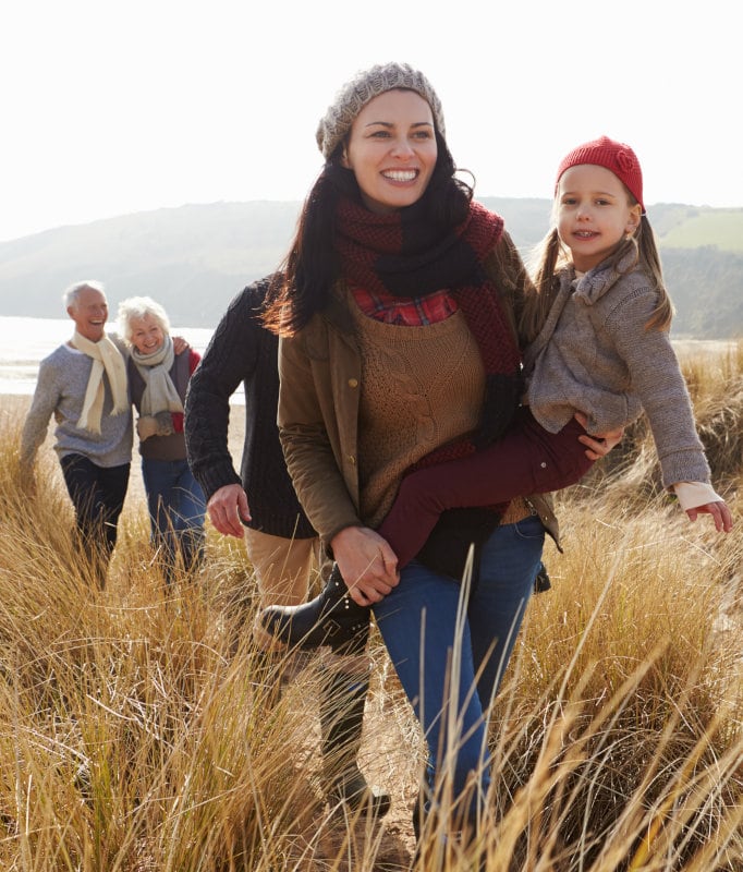 Family walking near the sea